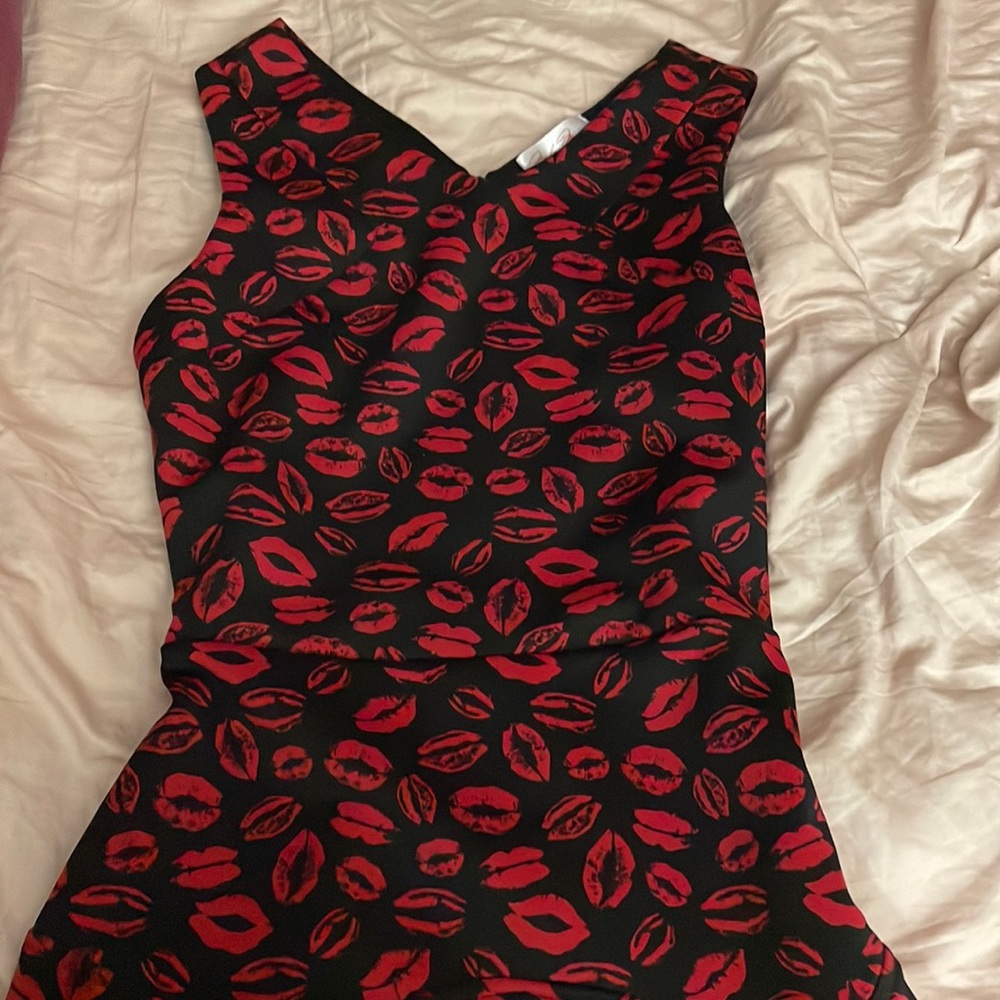 Black mini dress with red lip print